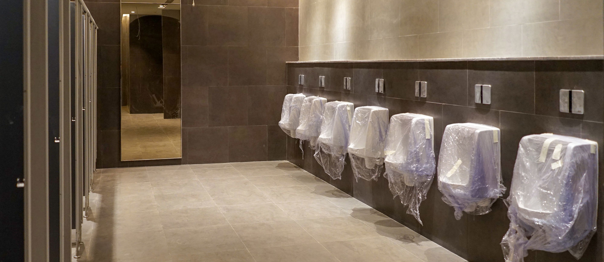 Newly installed public bathroom for a Commercial and Institutional Plumbing client